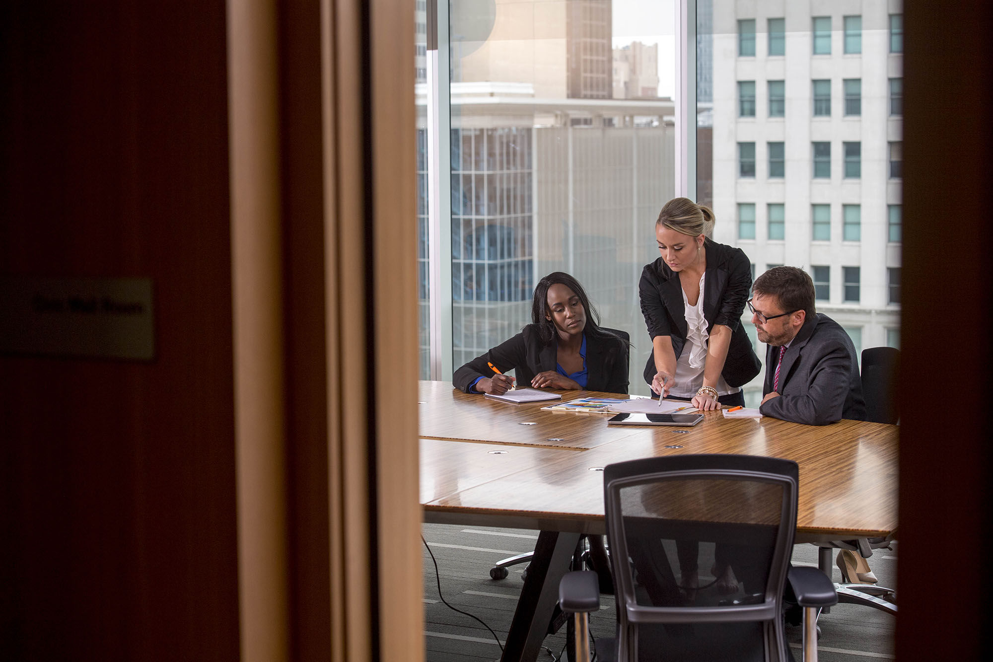 Professional studies students discussing at table