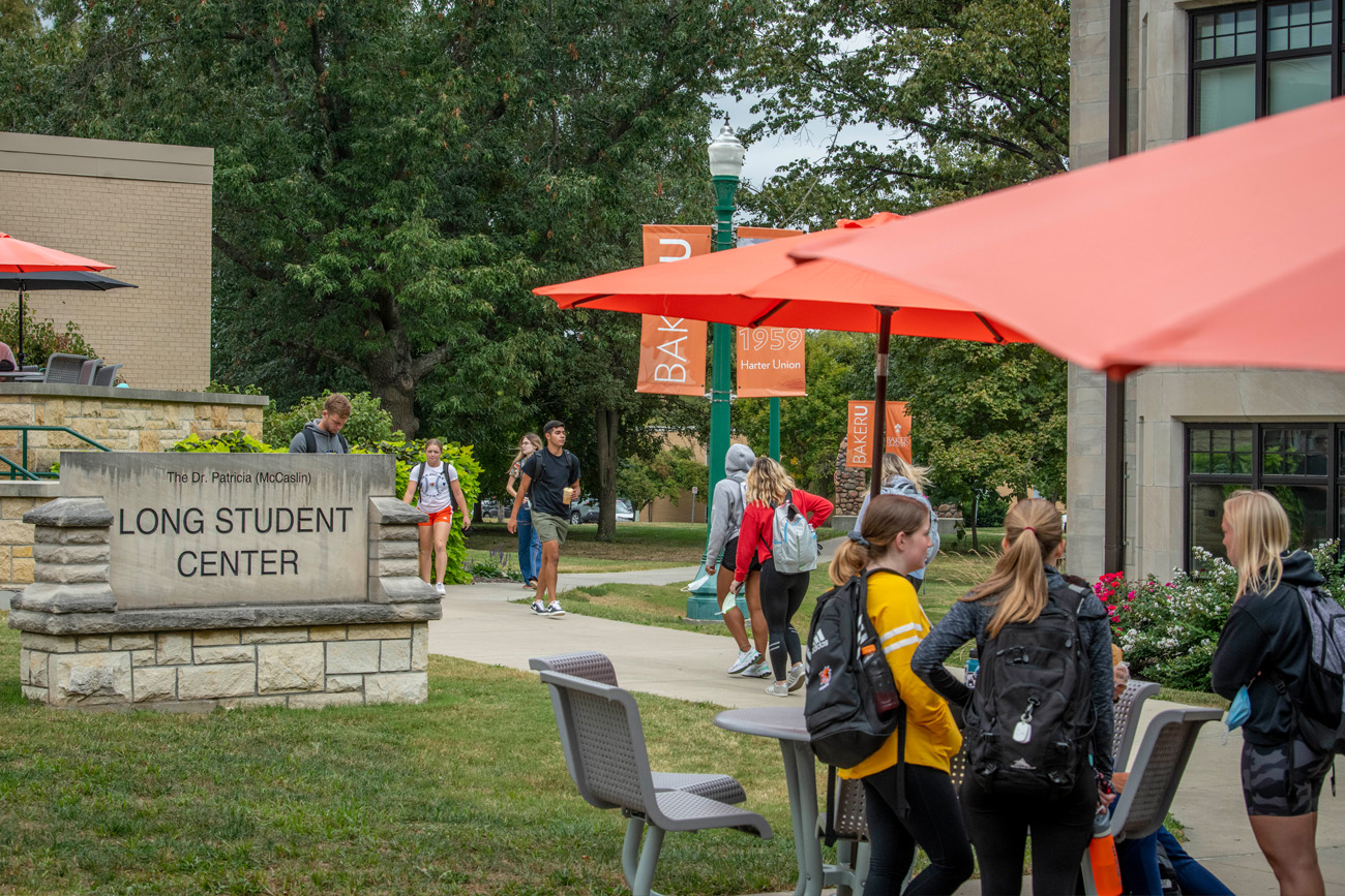 Students walking on campus in front of the union