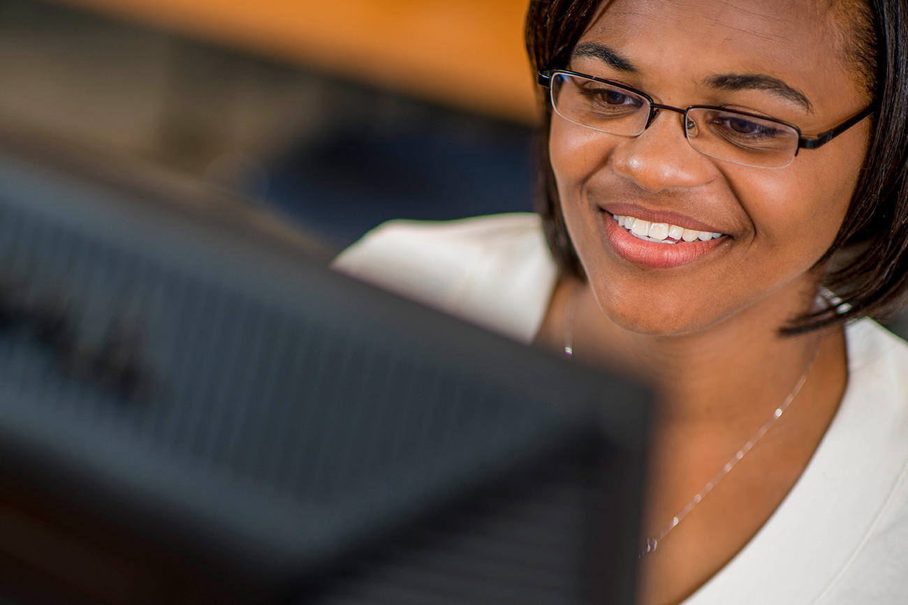 Woman working on computer.