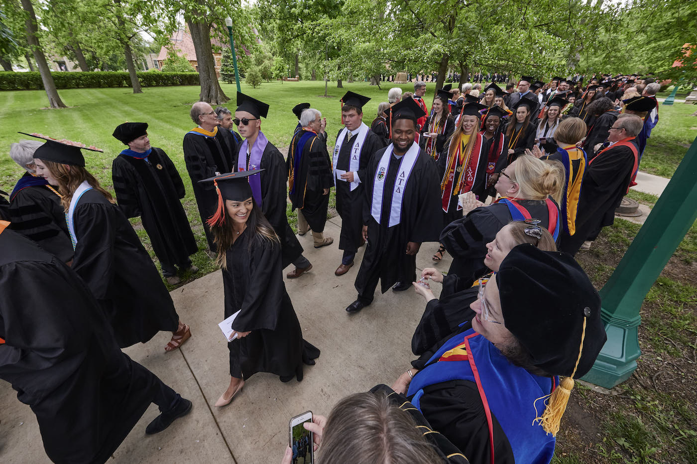 Students walking to commencement ceremony