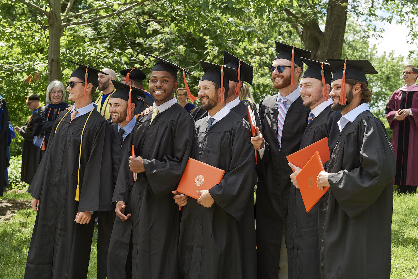 Students posing in caps and gowns