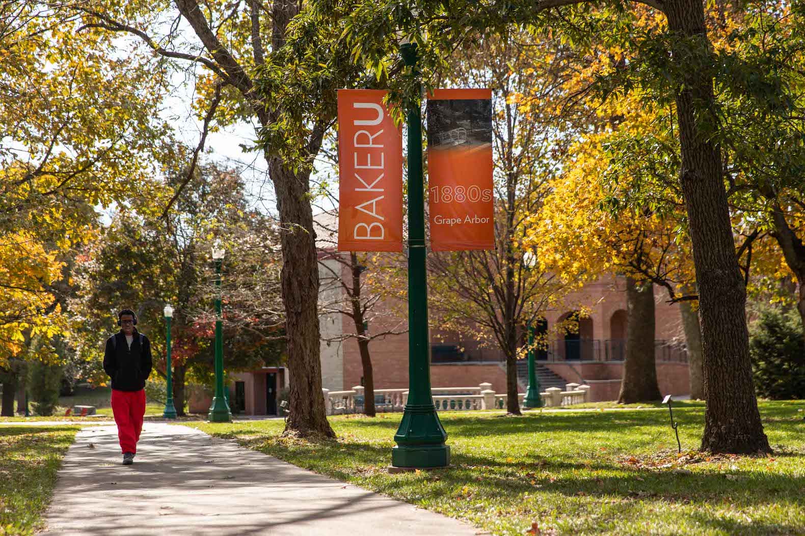 Pretty fall campus picture, student walking