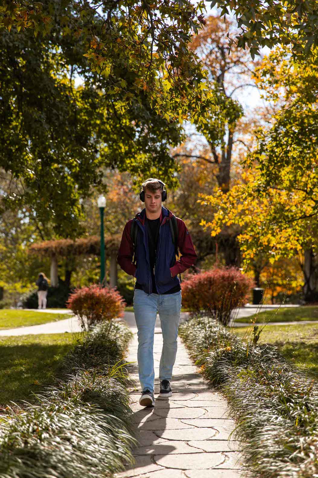Male student walking through campus