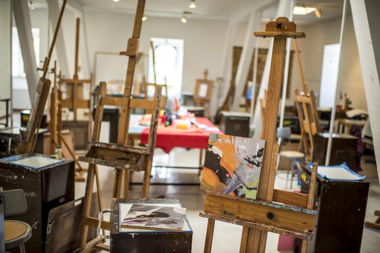 Art studio with paintings on easel