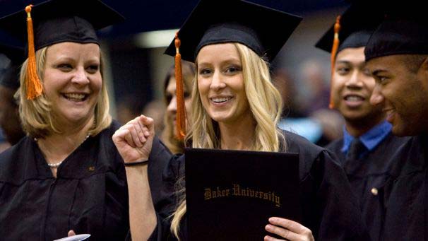 Students personally celebrating at commencement ceremony