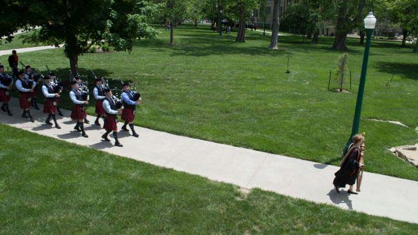 Bagpipers walking on campus during commencement ceremony