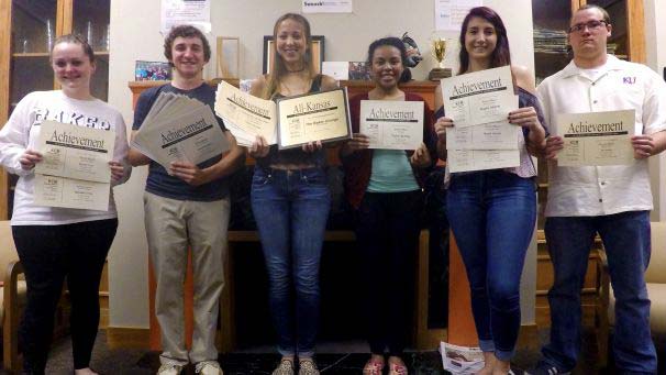 Baker Orange students holding awards