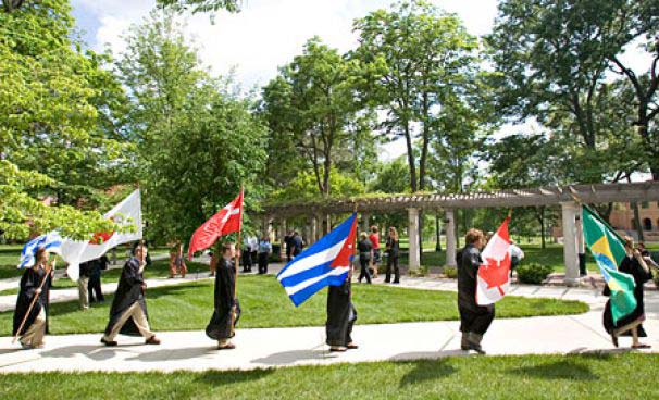 Students holding flags of different countries