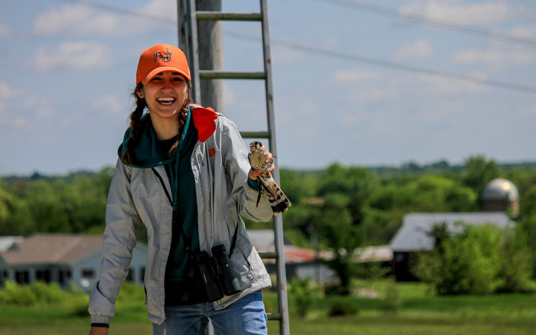 Cordy Wesonig holding a Kestrel bird