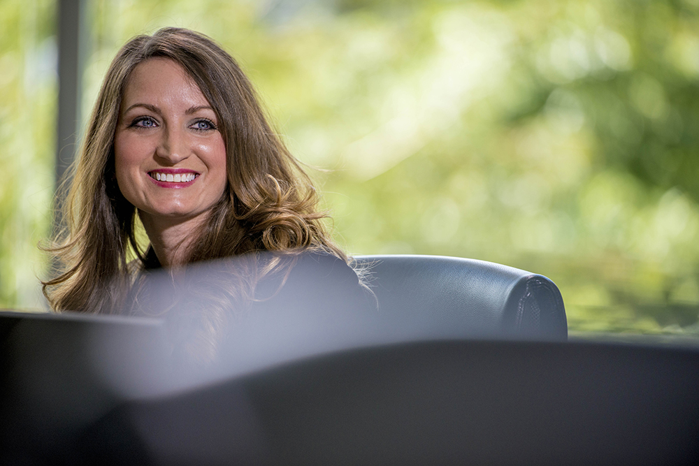 Student smiling at the camera in professional clothes