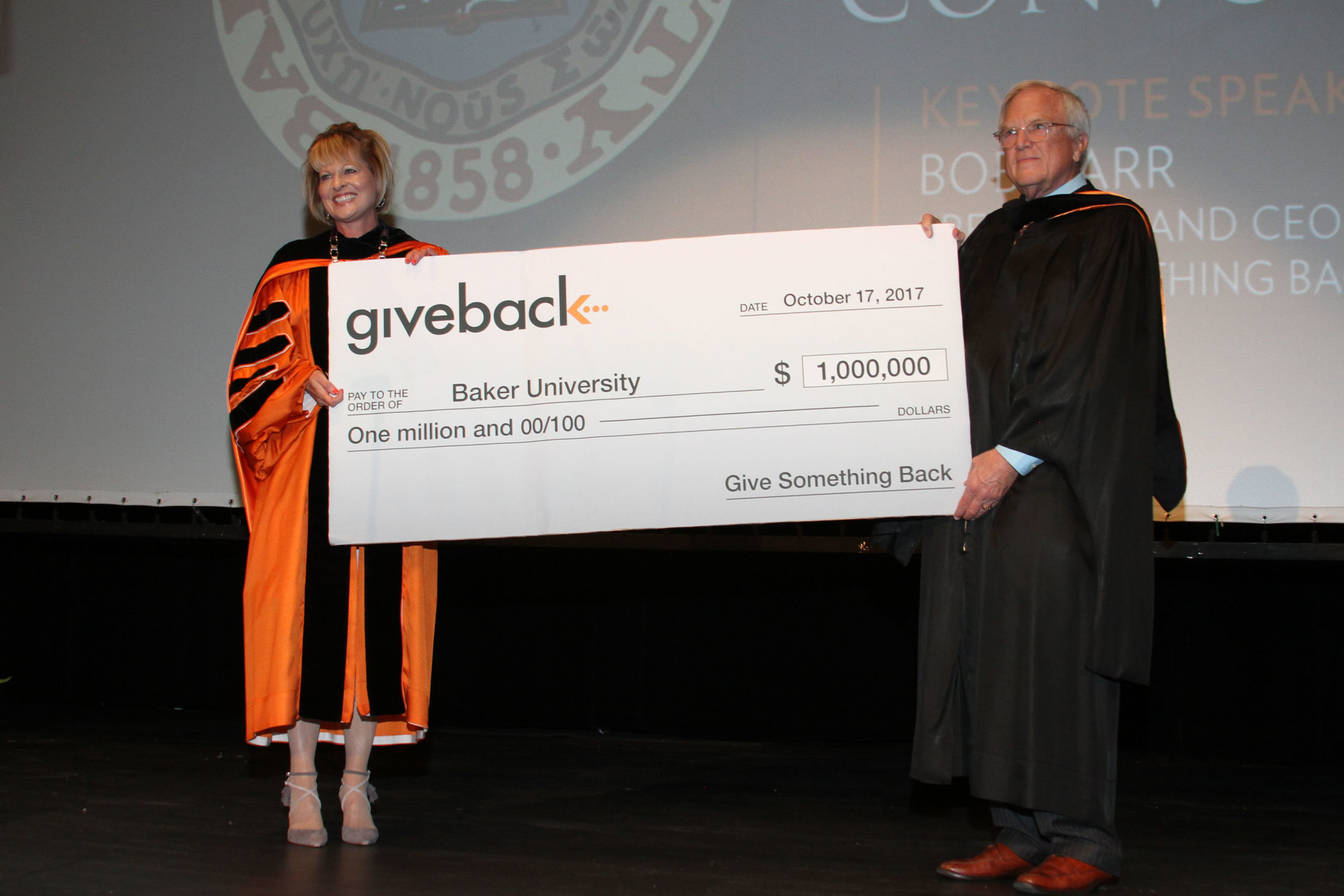 Dr. Murray and Bob Carr holding a check for one million dollars to Baker University.
