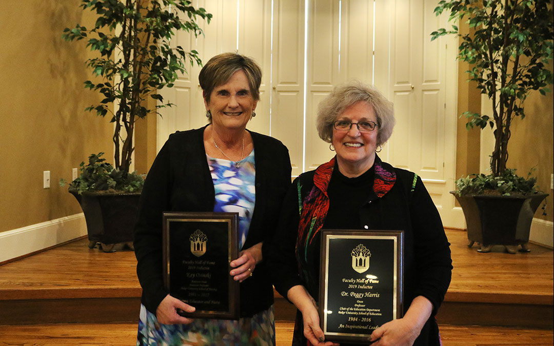 Dr. Peggy Harris and Professor Kay Osinski with Faculty Hall of Fame plaque
