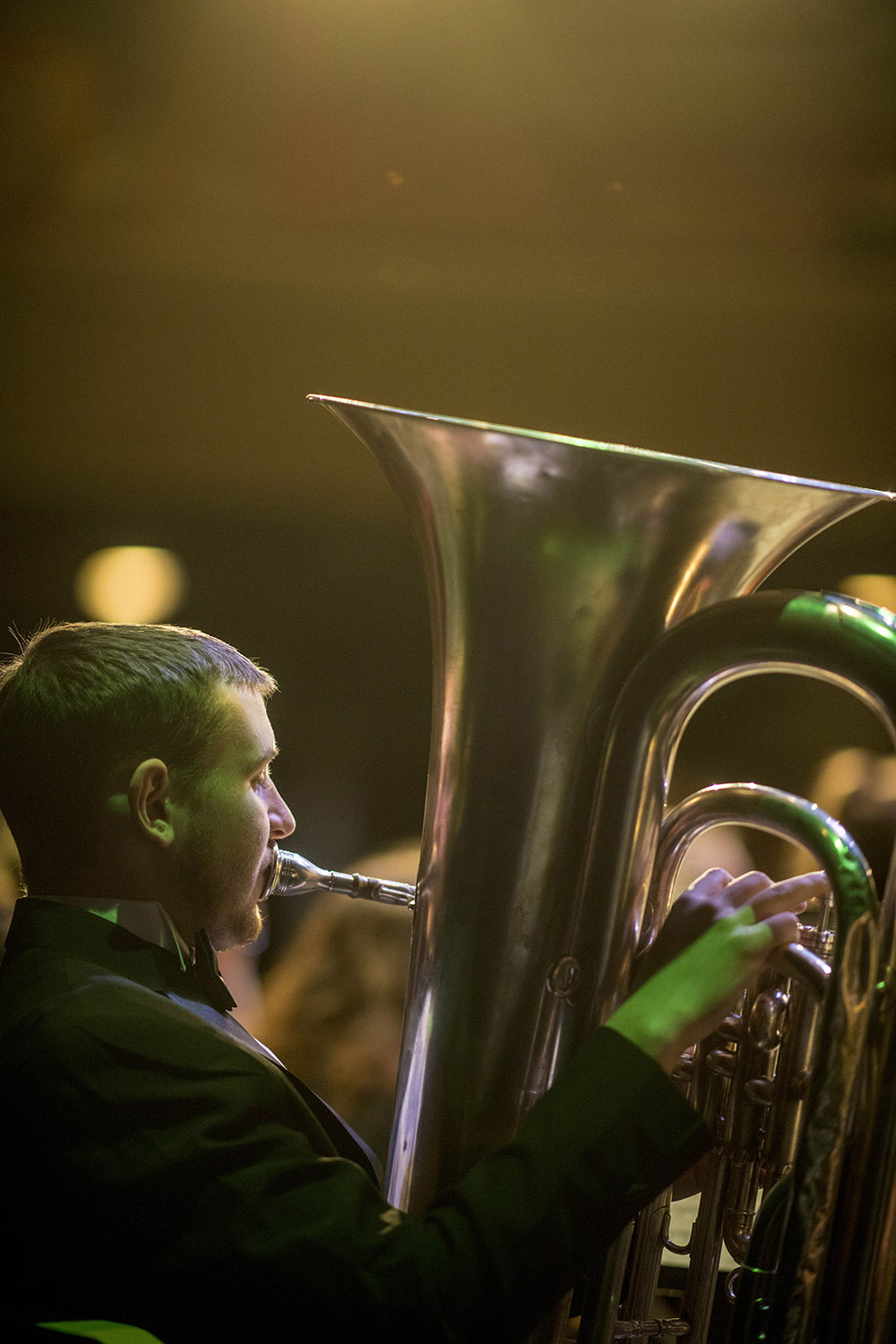 Male student playing the baritone at a band concert