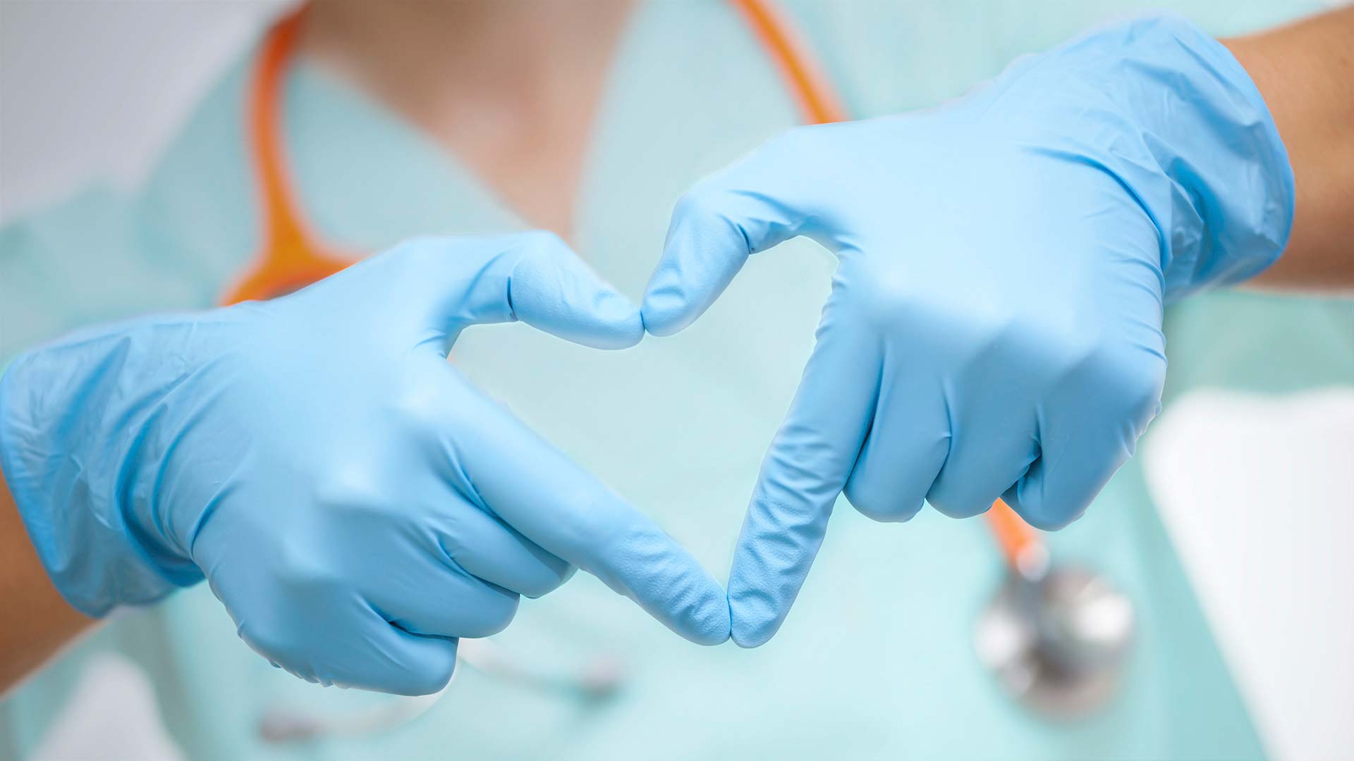 Nurse with heart hands