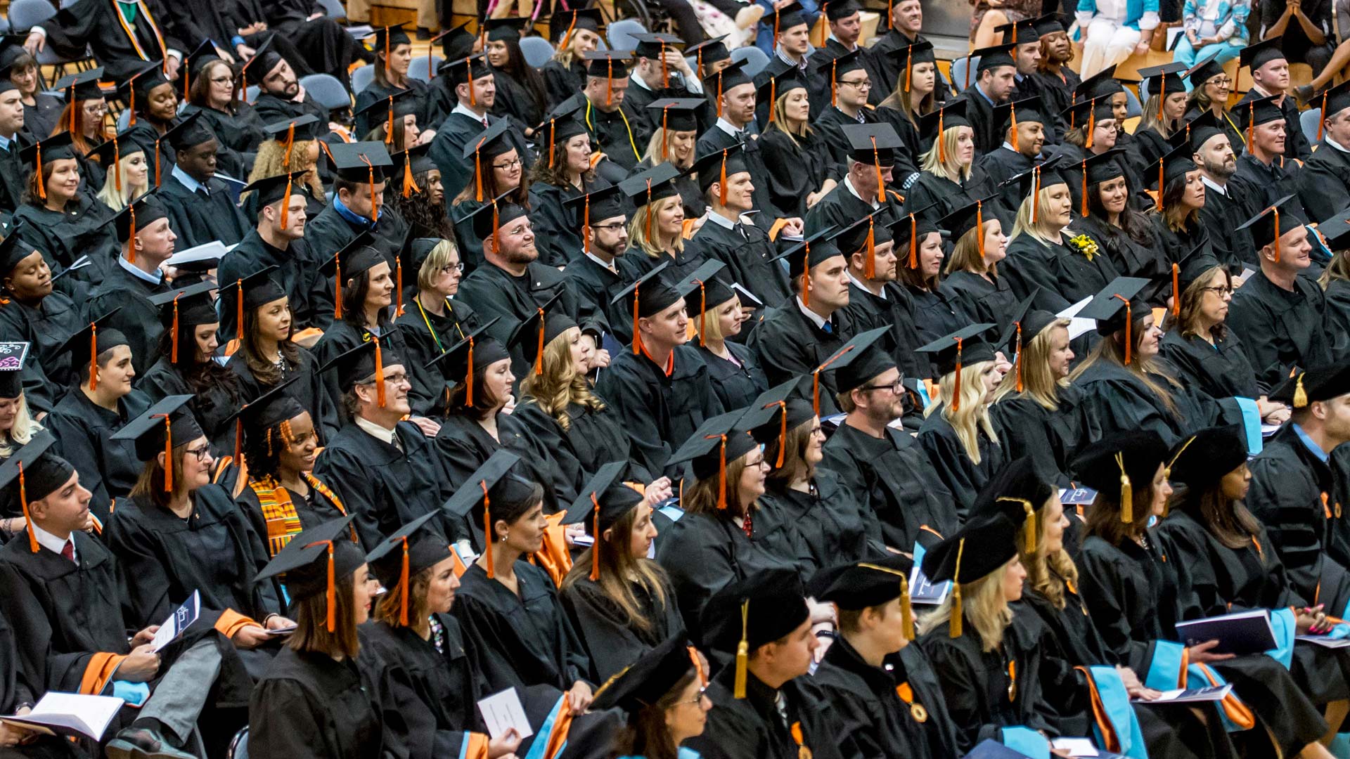 Graduating students sitting at commencement