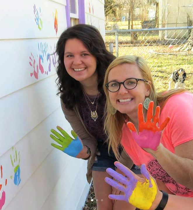 Students painting house for Baker Serves