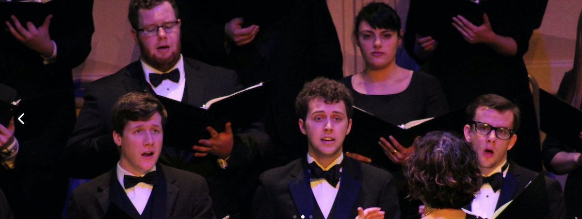 Choir students singing during performance