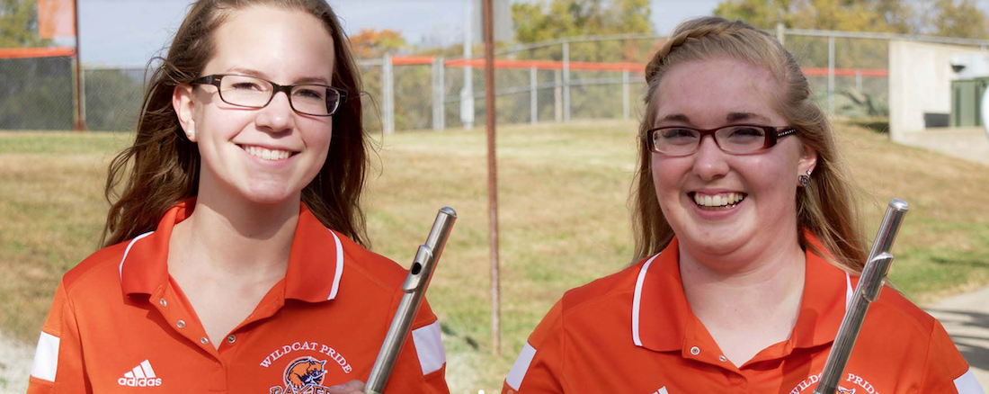 Two female band students smiling