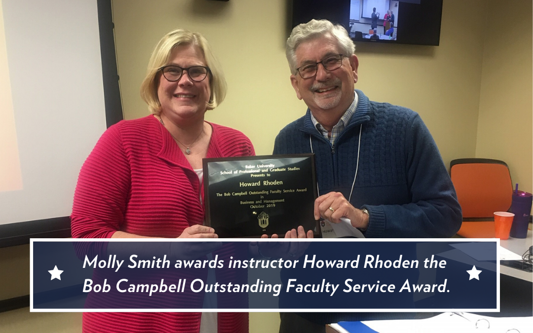 Molly Smith pictured with Howard Rhoden, both holding Rhoden's outstanding faculty service award