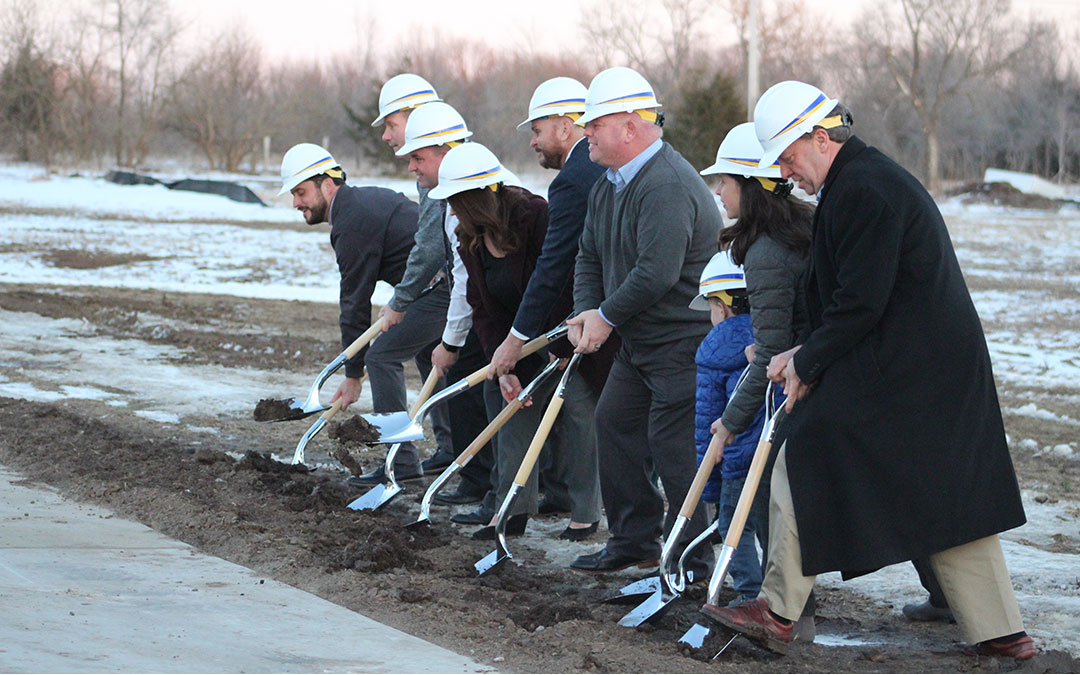 Community members digging on new solar facility