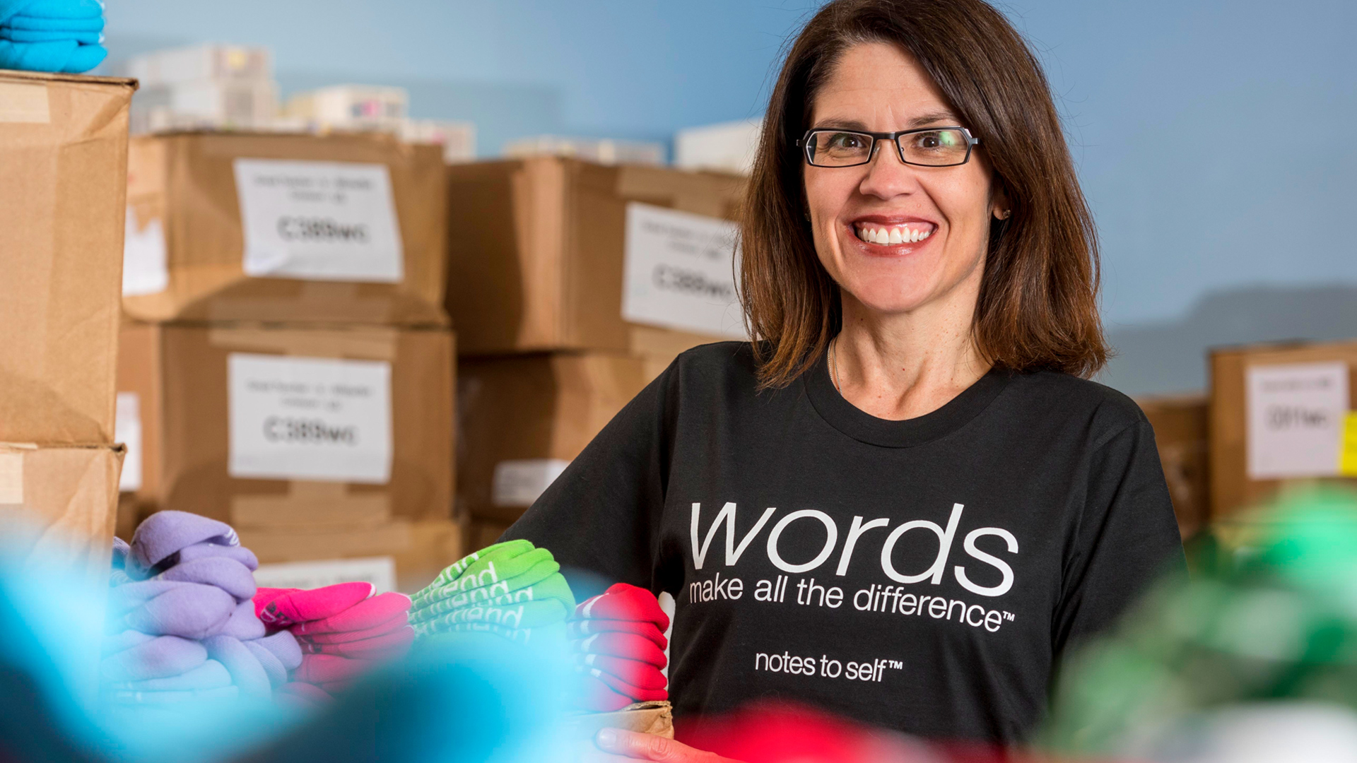 Laura Schmidt stands in notes to self warehouse.