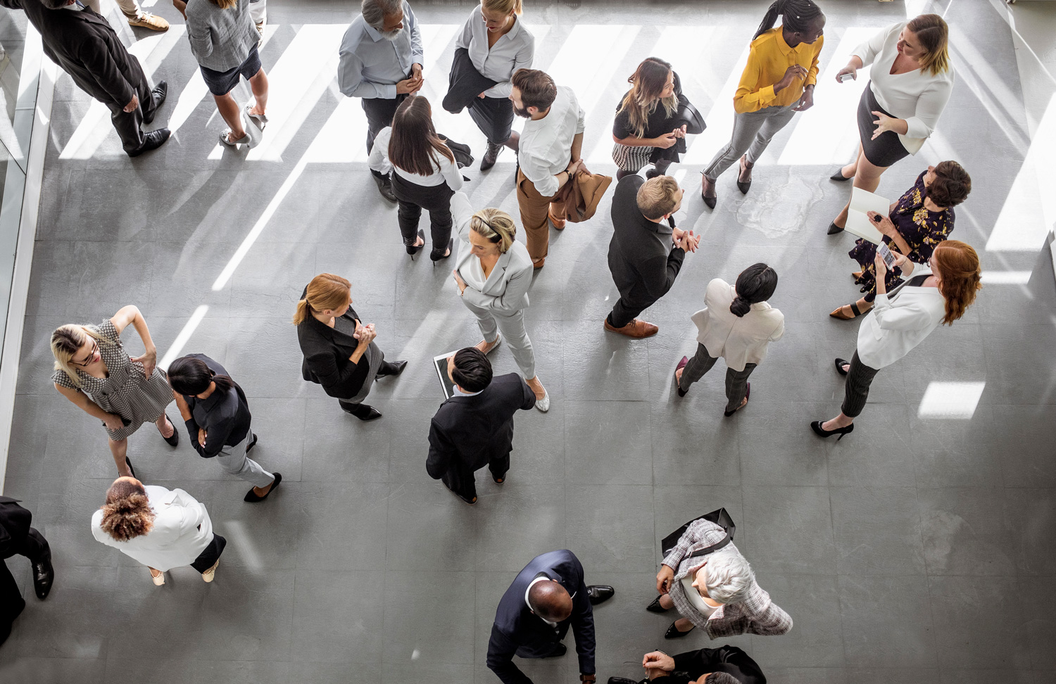 Overhead view of people standing in a lobby