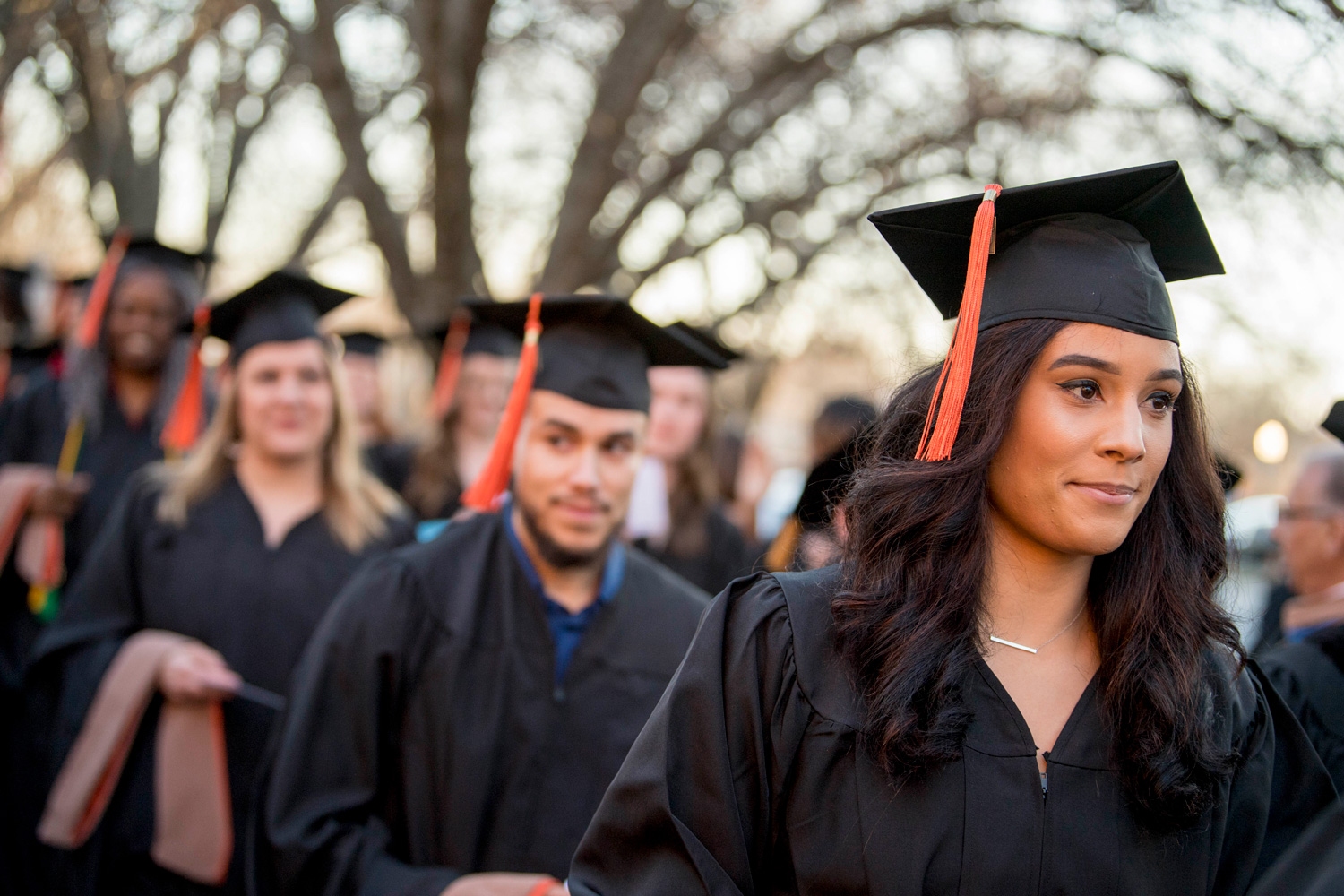 graduates outside at commencement