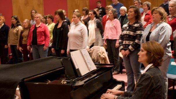 Community Choir members singing during performance