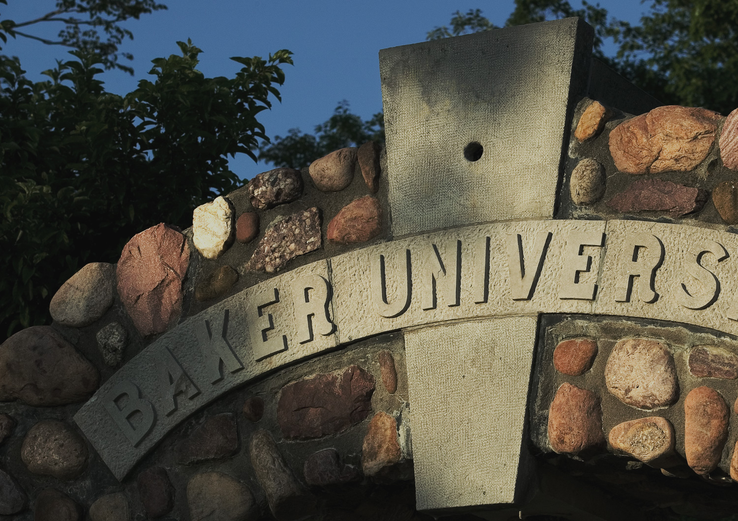 Stone arch with Baker University carved on the arch.