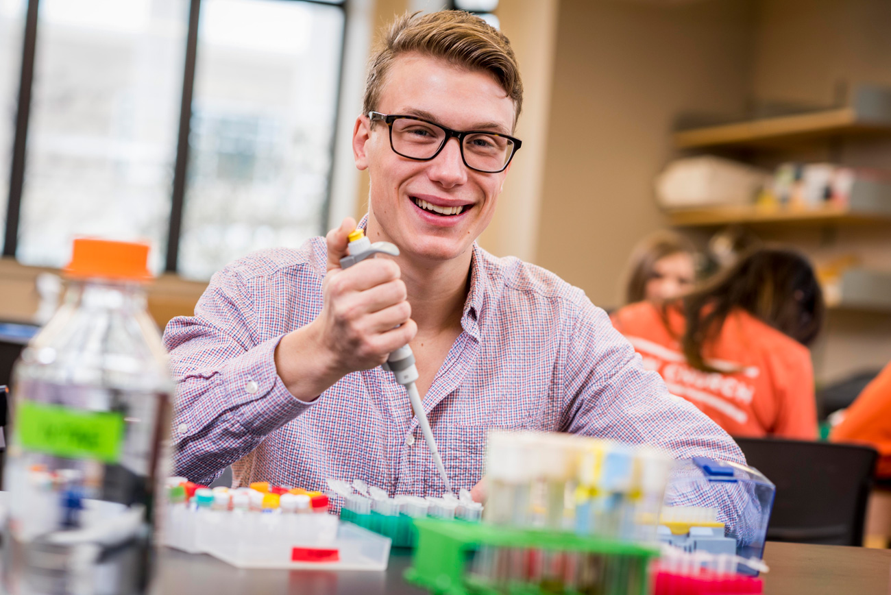 Male biochemistry student in classroom