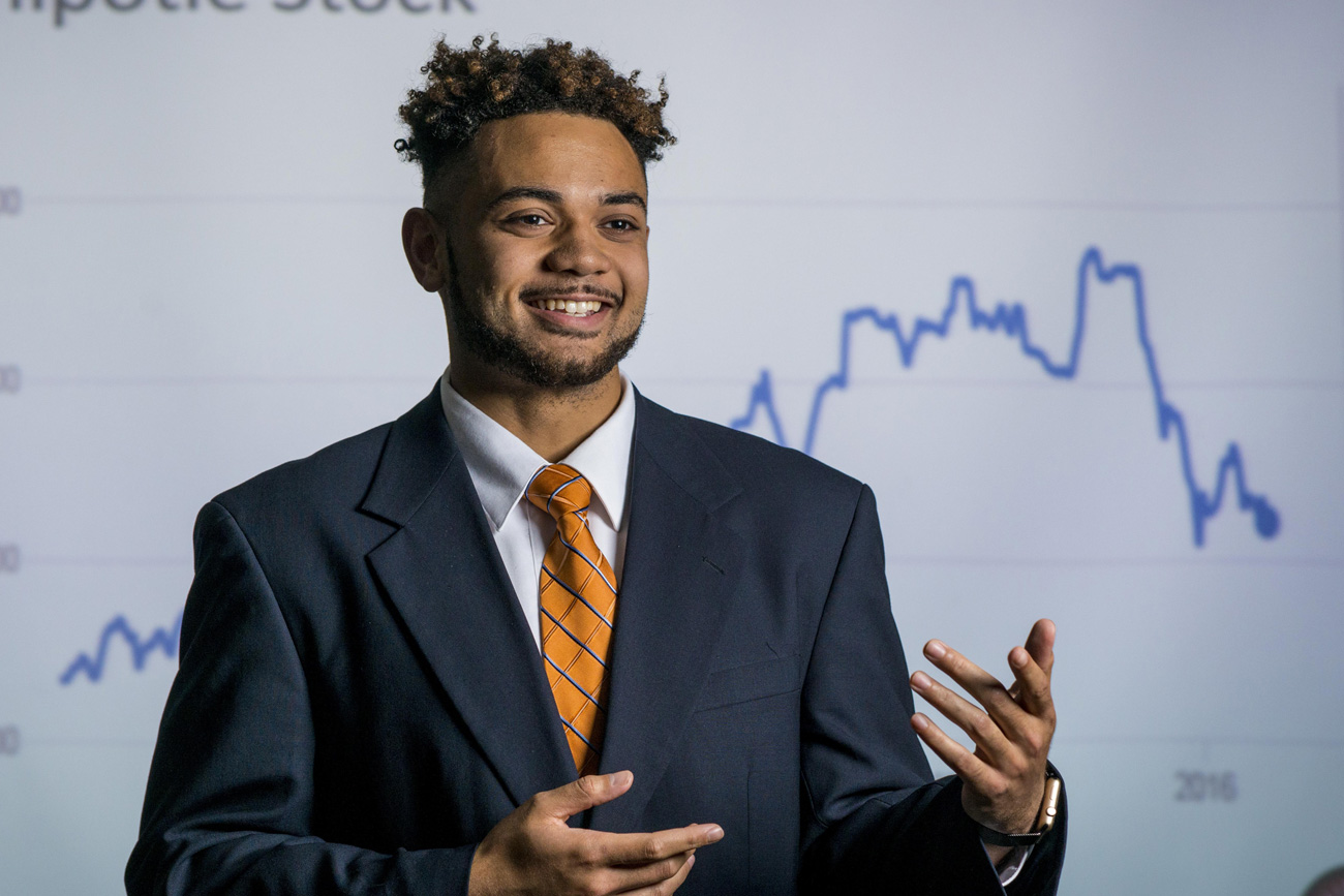 Business student smiling and presenting