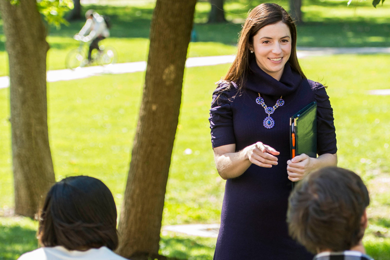 Communications professor teaching outside