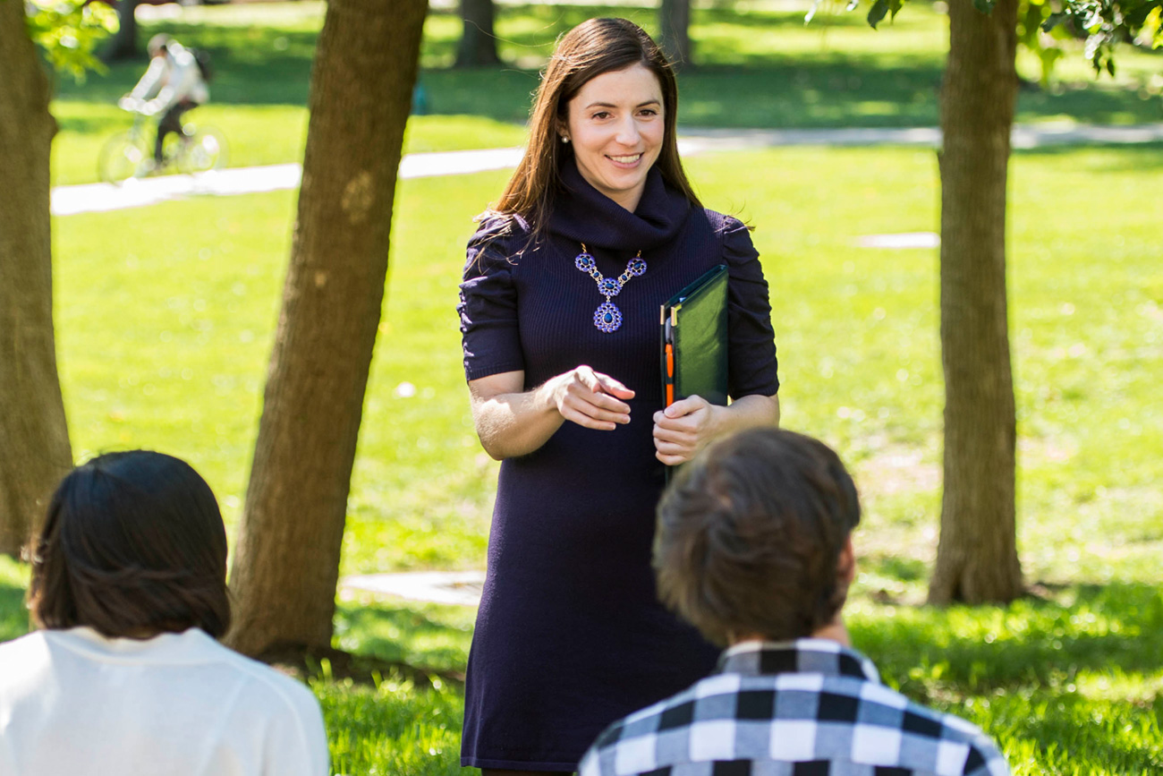 Communications professor holding class outside