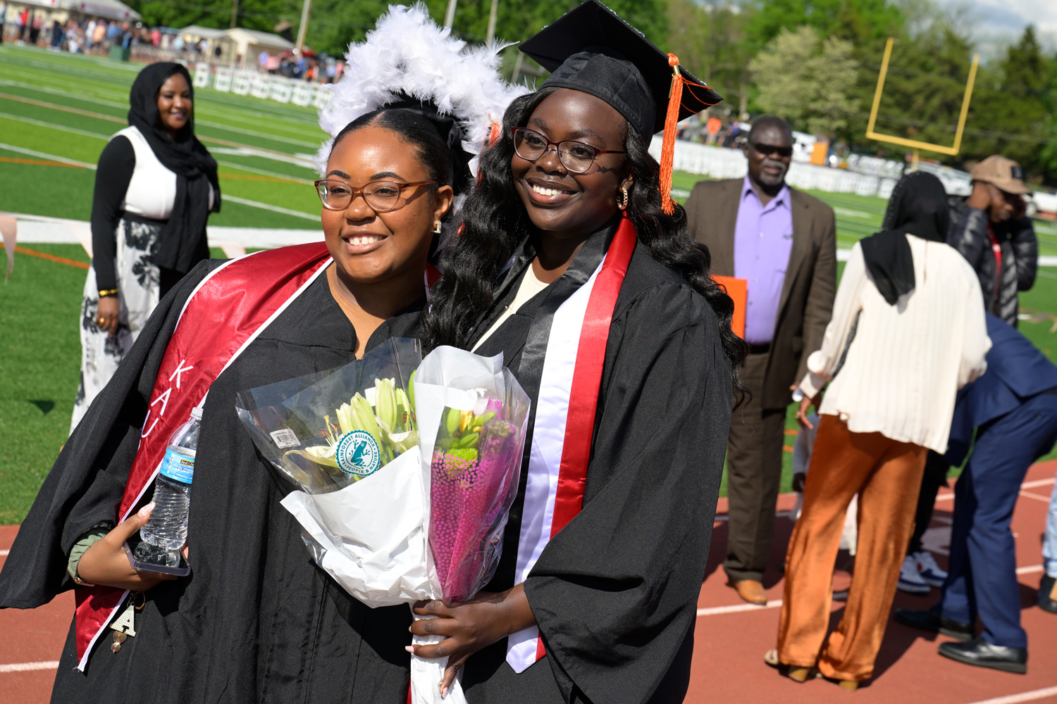 two students celebrating during commencement