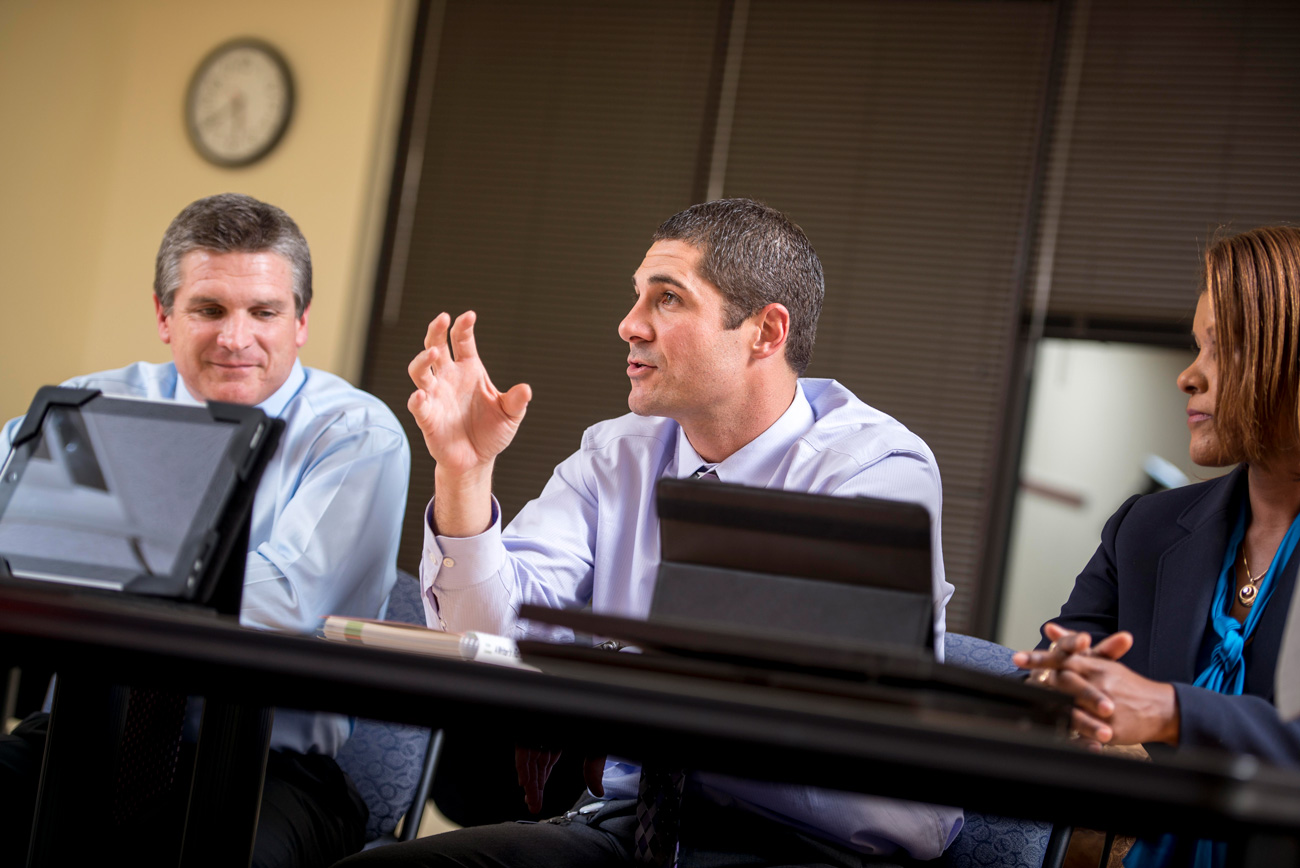 educators in a classroom discussing a masters instructional design & performance technology course