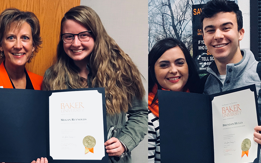 Two student recipients of the Harter Scholarship holding their award