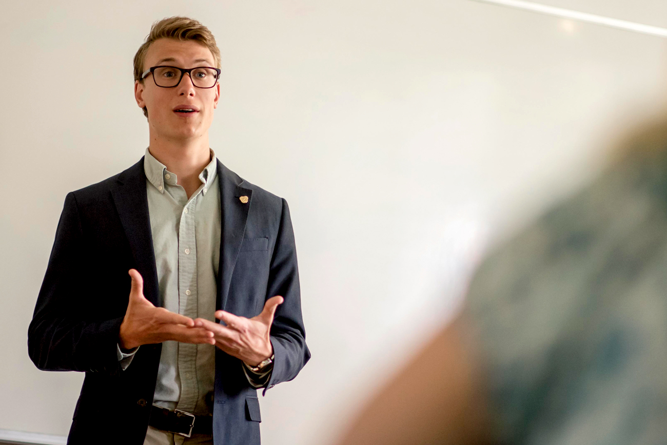 Male student giving a presentation