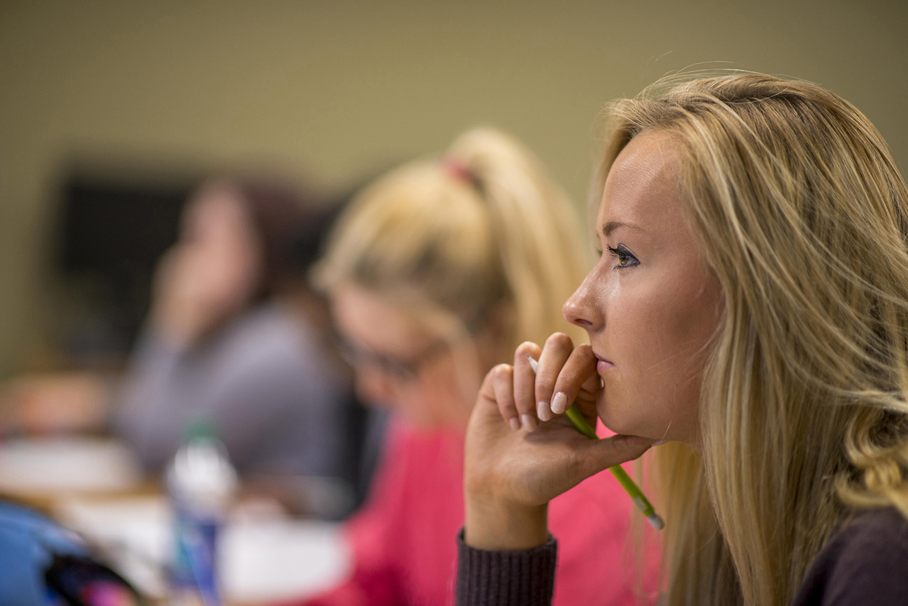 mathematics student paying attention to the professor in class