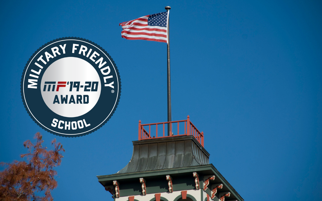 Parmenter Hall with flag and military friendly school award