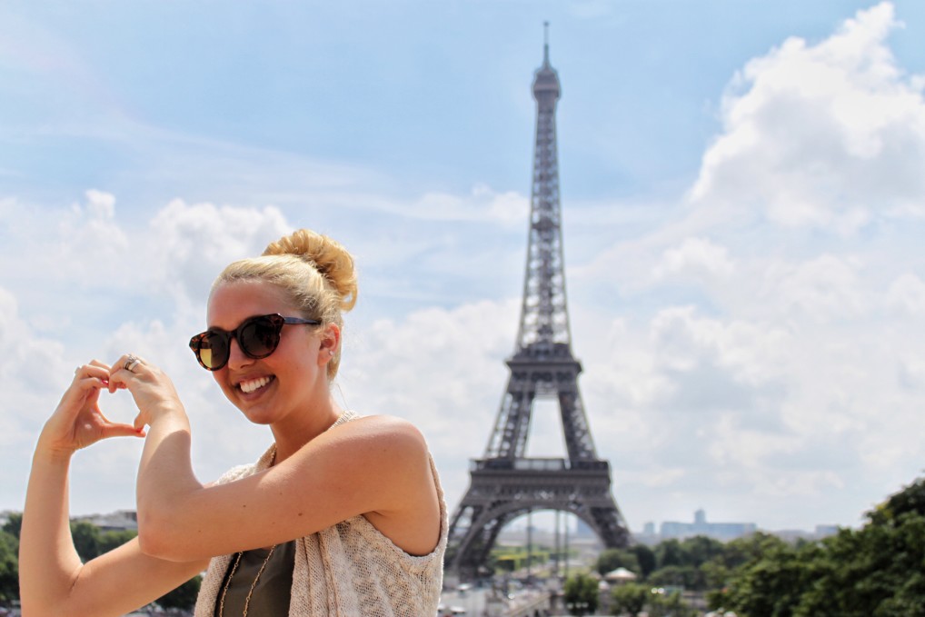 Study abroad student in front of Eiffel Tower