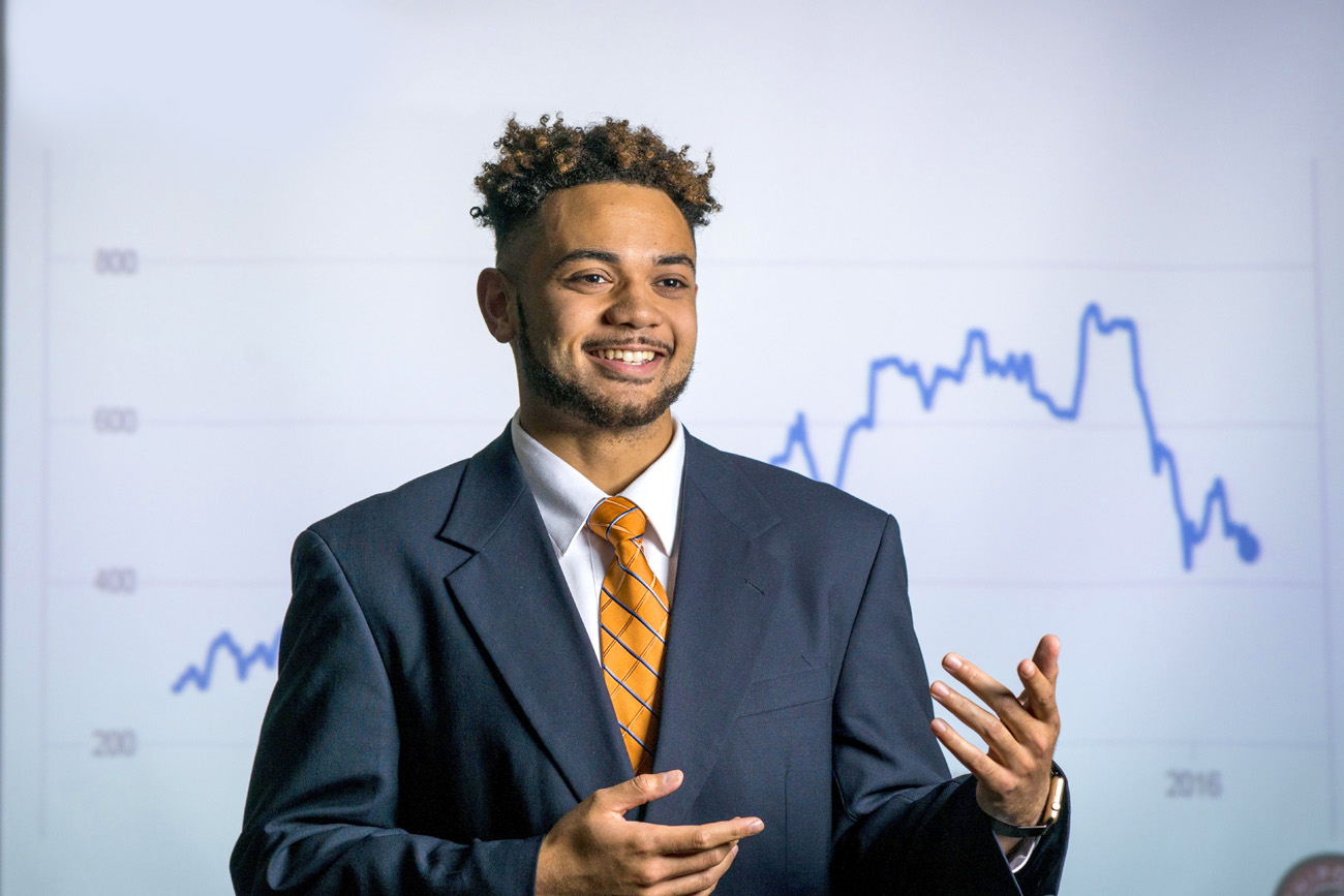 Male business student giving a presentation