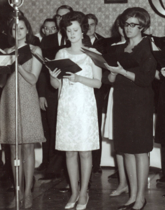 black and white photo of women singing from archives mission