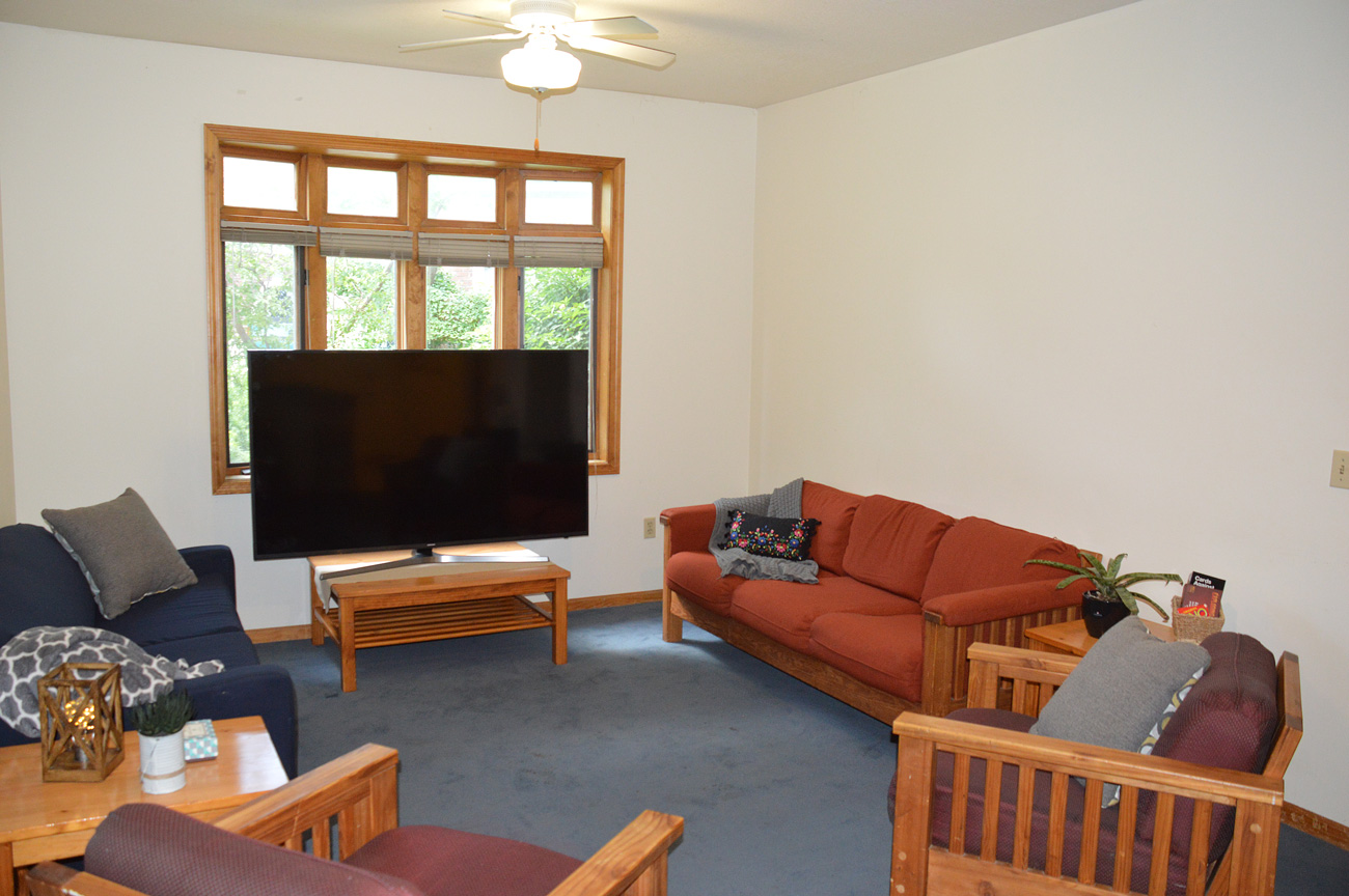 Photo of a furnished living room within the apartments on Baker University's campus