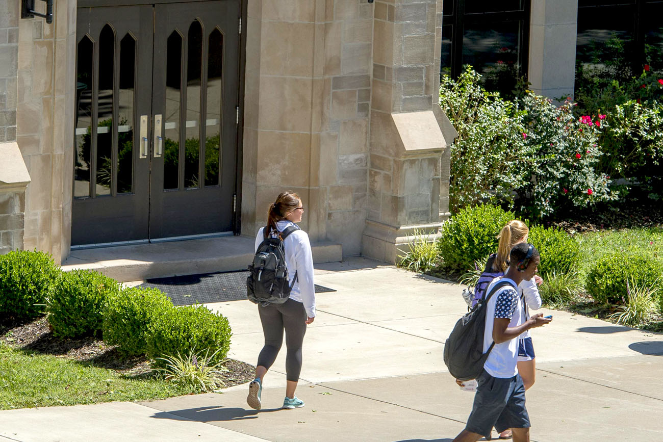 Students Walking On Campus In Front Of Mulvane Boyd Center