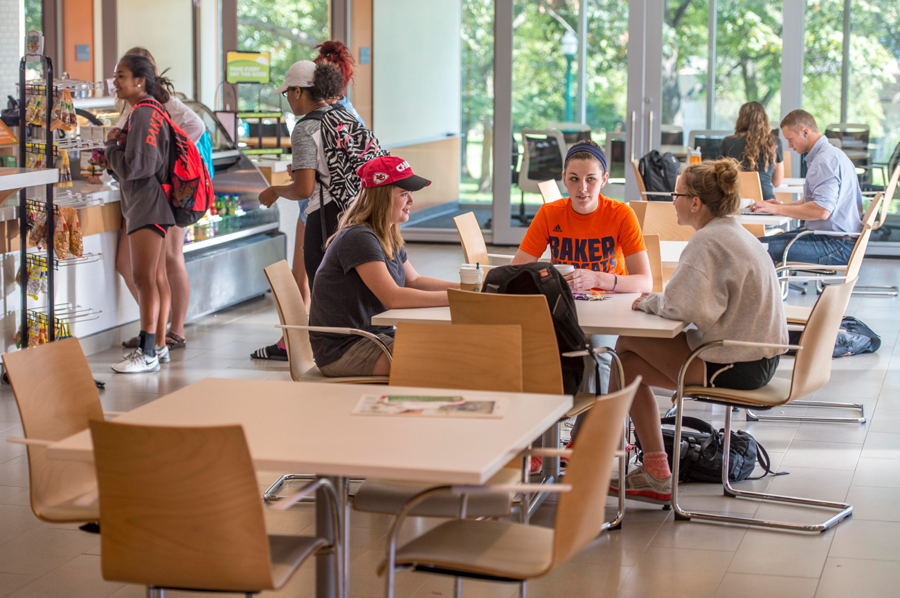 Students socializing, studying, and buying coffee in the student union