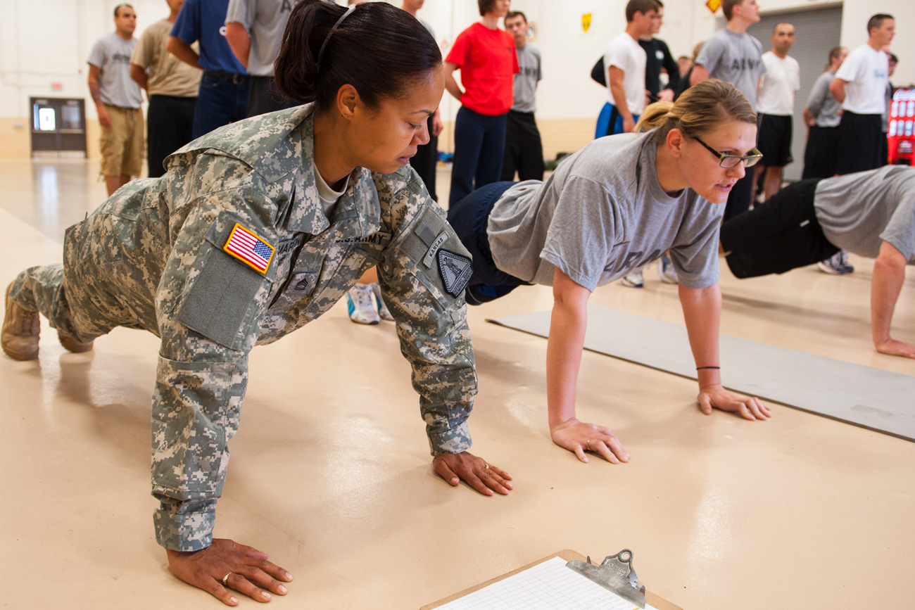 two military students holding a plank