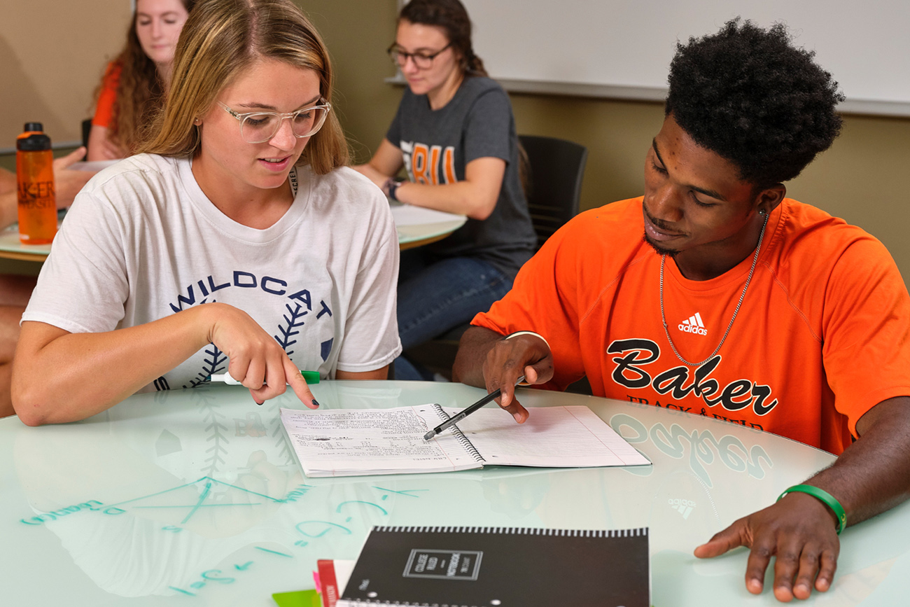 Two students studying together in class