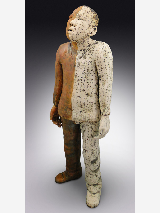 Ceramic sculpture of a man standing