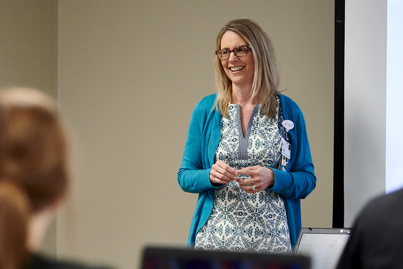 Nursing professor giving a lecture to students in a classroom