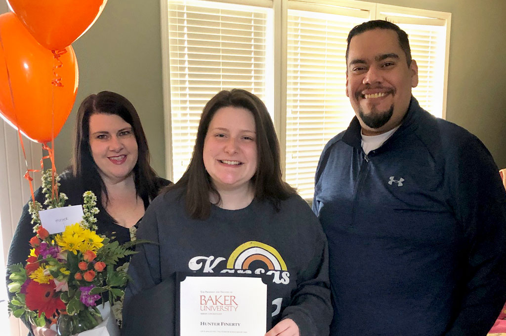 Hunter Finerty and her family with Harter Scholarship certificate